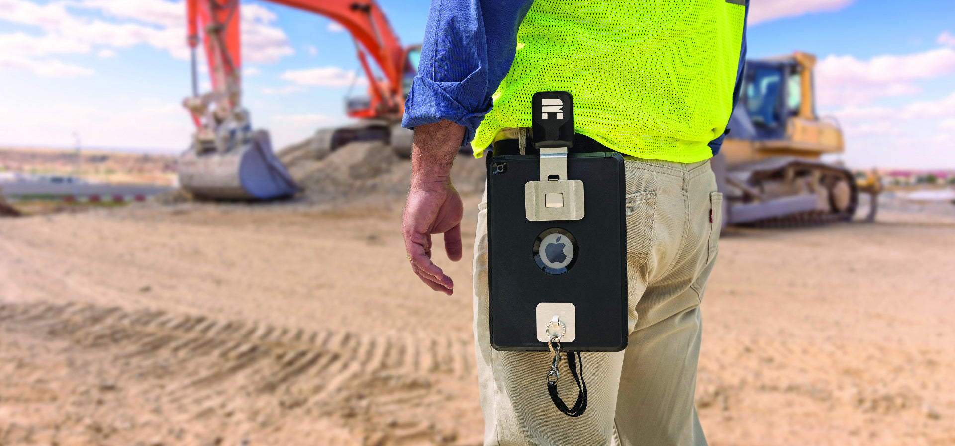 Construction worker carrying an iPad with a Tablet Belt Clip on a job site